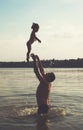 Father and Daughter Playing Together at the sea. Toned