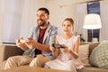 Father and daughter playing video game at home Royalty Free Stock Photo