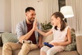 Father and daughter playing video game at home Royalty Free Stock Photo