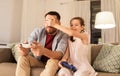 Father and daughter playing video game at home Royalty Free Stock Photo