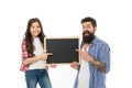 Father and daughter pointing at blank chalkboard. List things to do together. Child and father best friends. Parenthood