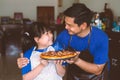 Father and daughter preparing homemade pizza with smile and happy Royalty Free Stock Photo