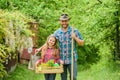 Father and daughter on ranch. family farm. ecology. Gardening tools. little girl and happy man dad. earth day. spring Royalty Free Stock Photo
