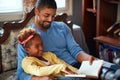 Father and daughter reading Christmas fairy tales