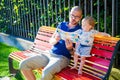 Father and daughter reading a primer Royalty Free Stock Photo