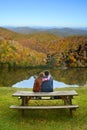 Father and daughter relaxing on a hiking trip.