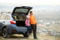 Father and daughter sitting in car and looking on nature Royalty Free Stock Photo