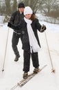 The father, the daughter and skis.