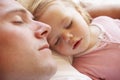 Father And Daughter Sleeping In Bed