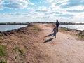 Father and daughter smiling walking running on empty beach. Lifestyle photo real people. Happy active family having fun Royalty Free Stock Photo