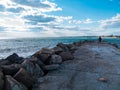 Father and daughter smiling walking running on empty beach. Lifestyle photo real people. Happy active family having fun Royalty Free Stock Photo