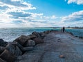 Father and daughter smiling walking running on empty beach. Lifestyle photo real people. Happy active family having fun Royalty Free Stock Photo