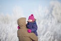 Father and daughter at snowy park