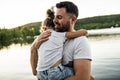 Father and daughter solace on the pier warm summer day h