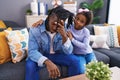 Father and daughter stressed sitting on so at home Royalty Free Stock Photo