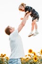 father with daughter at sunflowers field Royalty Free Stock Photo