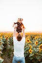 father with daughter at sunflowers field Royalty Free Stock Photo