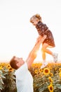 father with daughter at sunflowers field Royalty Free Stock Photo