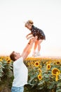 father with daughter at sunflowers field Royalty Free Stock Photo