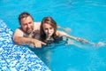 Father and daughter swimming in the poo Royalty Free Stock Photo