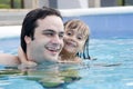 Father and daughter in Swimming pool Royalty Free Stock Photo