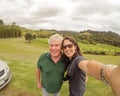 Father and daughter taking selfie - family tourists travelling t
