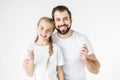 Father and daughter with toothbrushes Royalty Free Stock Photo