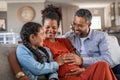 Father and daughter touching baby bump of pregnant woman Royalty Free Stock Photo