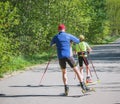 Father and daughter training on the roller skaters