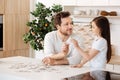 Father and daughter uniting two jigsaw puzzle pieces Royalty Free Stock Photo