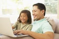 Father And Daughter Using Laptop At Home Royalty Free Stock Photo