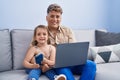 Father and daughter father and daughter using laptop and smartphone at home Royalty Free Stock Photo