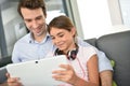 Father and daughter using tablet at home Royalty Free Stock Photo
