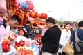 A father and a daughter is visiting the Chinese new year market