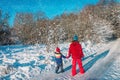 Father with daughter walk in winter forest Royalty Free Stock Photo