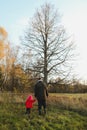 father and daughter walking in autumn forest Royalty Free Stock Photo