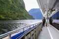 Father with daughter walking on the deck of touring boat. New Zealand