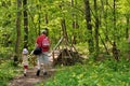 Father and daughter walking through the forest Royalty Free Stock Photo