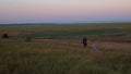 Father and daughter walking by lakes on evening nature lansdcape. A little girl hiking with dad outdoor. Tourist child leading her