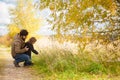 Father and daughter walking together, autumn day. Royalty Free Stock Photo