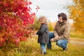 Father and daughter walking together, autumn day. Royalty Free Stock Photo