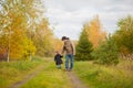 Father and daughter walking together, autumn day. Royalty Free Stock Photo