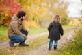 Father and daughter walking together with cat. Royalty Free Stock Photo