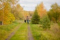 Father and daughter walking together with dog, autumn day. Royalty Free Stock Photo