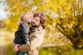 Father and daughter walking together, autumn day. Royalty Free Stock Photo