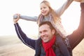 Father And Daughter Walking On Winter Beach Royalty Free Stock Photo