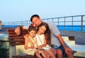 Father and Daughters Playing Together at the Beach at Sunset. Ha