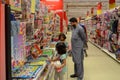 Father and daughters shopping in Hyperstar Supermarket