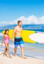 Father and Duagher on the Beach Going Surfing Royalty Free Stock Photo