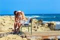 Father embracing and comforting his sad and pouting baby daughter outside on a warm summer day. Royalty Free Stock Photo